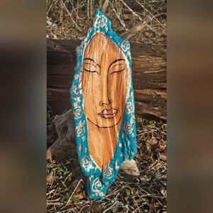 Handcrafted Wooden Face Art with Blue Accents